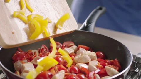 Frying vegetables and chicken white meat. Stock Footage 46452858
