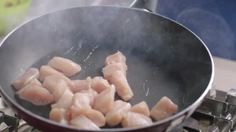 Frying vegetables and chicken white meat. Stock Footage 46454176