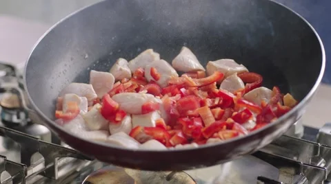 Frying vegetables and chicken white meat. Stock Footage 46470068