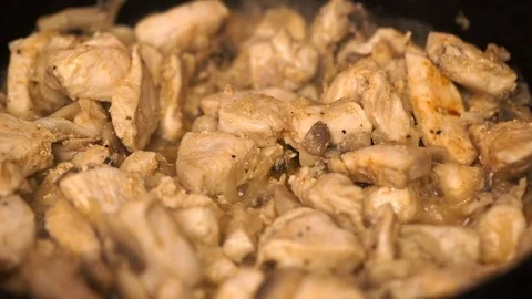 Frying vegetables and chicken white meat Video stock 75928686