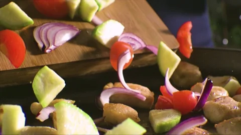 Frying vegetables and chicken white meat Stock Footage 77009395