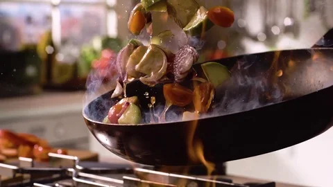 Frying vegetables and chicken white meat. Super slow motion shot Vídeos de archivo 77009724