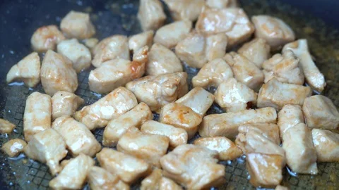 Frying vegetables and chicken white meat. Stock Footage 87366301