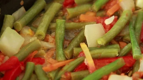 Frying vegetables in the pan. Stock Footage 72102174