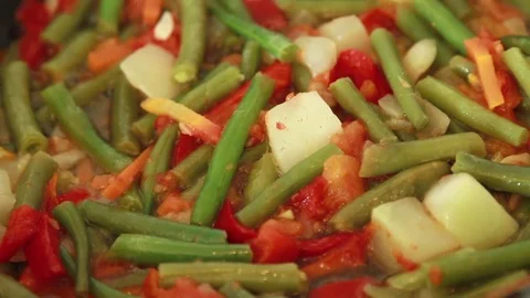 Frying vegetables in the pan. Stock Footage 72102361