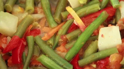 Frying vegetables in the pan. Stock Footage 72102443