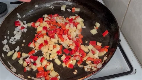 Frying Vegetables On A Pan Stock Footage 165542861