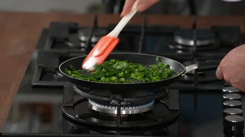 Frying vegetables in a pan Stock Footage 183555166