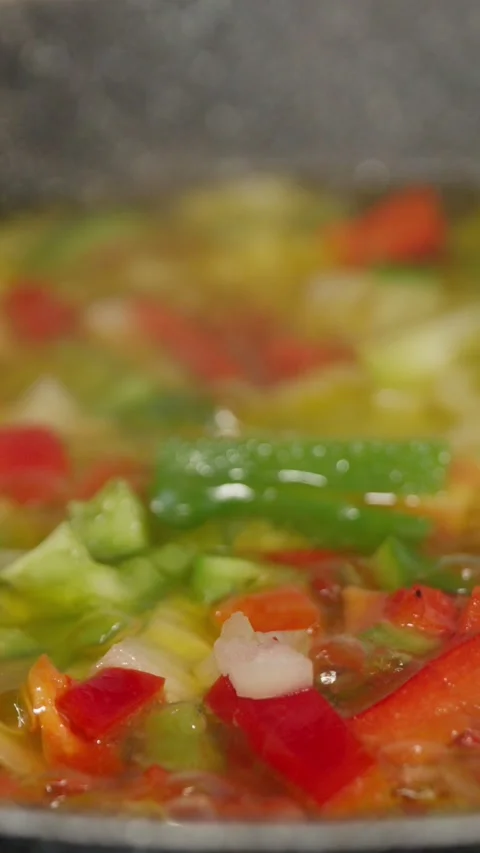 Frying vegetables in a pan Stock Footage 297213513