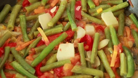 Frying vegetables in the pan mixed with spatula. Stock Footage 72102263