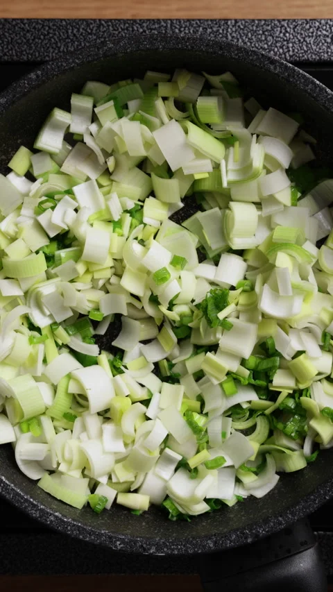 Frying Vegetables In Pan Top View Vertical Stock Footage 337191261
