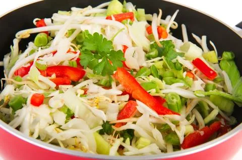 Frying wok pan with vegetables Stock Photos