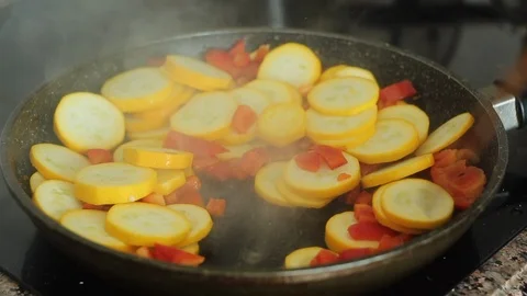 Frying zucchini with paprika in a pan. Stock Footage 116813406