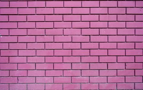 Fuchsia brick wall texture background material construction. Stock Photos