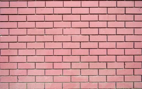 Fuchsia brick wall texture background material construction. Stock Photos