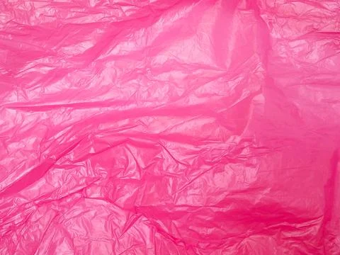 Fuchsia crumpled plastic bag texture background. Real High-Density Polyethylene Stock Photos