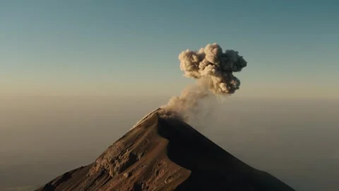 Fuego Volcano eruption with ash plume rising above summit at sunrise Guatemala Stock Footage 334450588