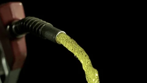 Fuel being sprayed out of the gun nozzle in slow motion Stock Footage 81222035