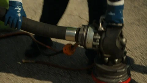 Fuel gas pump hose being set on ground Stock Footage 123729661
