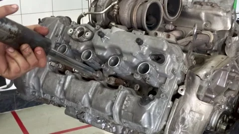 Fuel injector removal from car engine Stock Footage 169828062