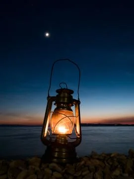 Fuel lantern on the beach 库存照片