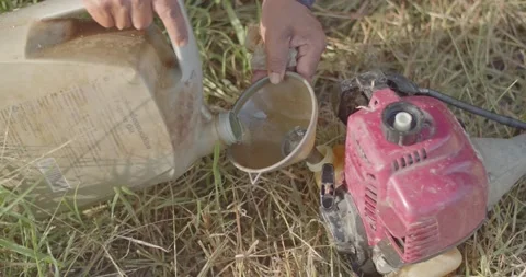 Fuel the mower in preparation for mowing. Stock Footage 222987060