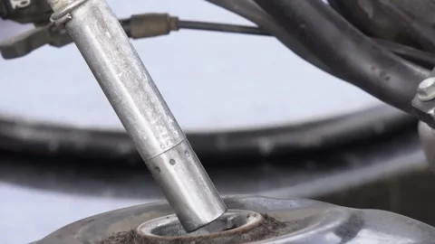 Fuel nozzle being inserted into a vehicle's fuel tank Stock Footage 314513163