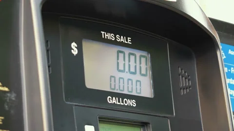 Fuel Pump Counting Dollars in 4K slow motion Stock Footage 88338482