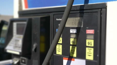Fuel Pump Counting Dollars in 4K slow motion Stock Footage 88832434