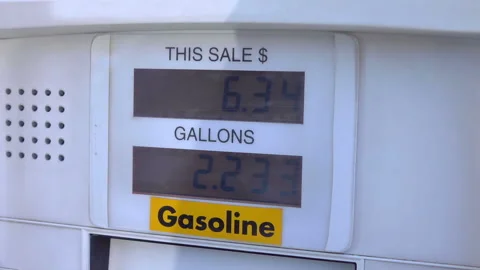Fuel pump counting dollars in slow motion 120fps Video stock 166098009