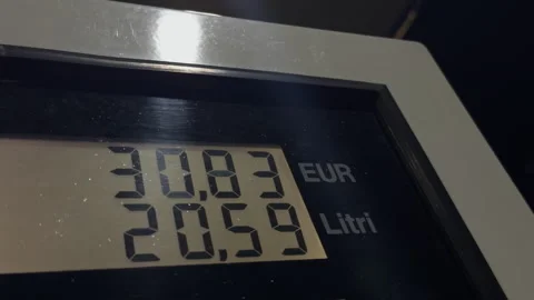 The Fuel Pump is Dispensing Gasoline while Showing the Price and Volume Display Stock Footage 296647592
