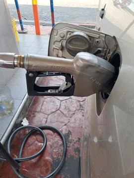 Fuel Pump Nozzle Resting inside Gas Station Box Dispenser Stock Photos