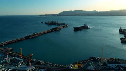 A fuel ship is moored to a berth for loading oil Stock Footage 128581474