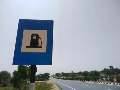 Fuel station or petrol pump sign board on highway Stock Photos
