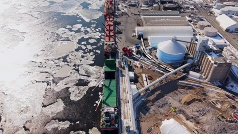 Fuel storage facility with tanks in snowy industrial area Stock Footage 329452447