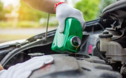 Fueling in the car engine before driving Stock Photos
