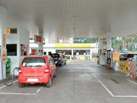 Fueling Up at the Shell Station Stock Photos