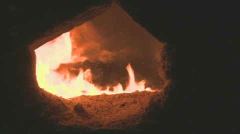 Fuelling a fire under a Hamam Stock Footage 38640588