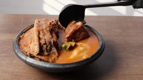 Fufu With Smoked Fish Light Soup and Goat Meat, Africa Ghana Traditional Dish Video stock 346249264