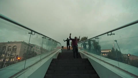 Fugitive running away from the police down the stairs Stock Footage 283066959