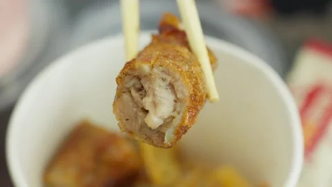 Fujian Five-Spice Meat Roll Held by Chopsticks Stock Footage 312588242