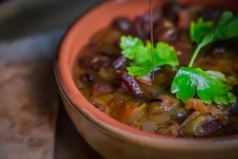 Ful Medames - is an Egyptian dish of cooked Fava beans served with vegetable oil Stock Photos