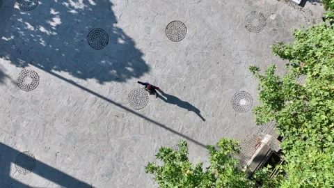 Full aerial view of the man and his shadow playing the zeybek, the most 스톡 동영상 246038783