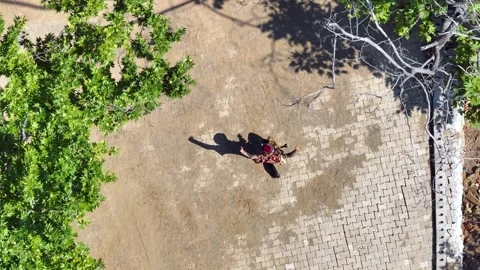 Full aerial view of the man and his shadow playing the zeybek, the most Stock Footage 246038807