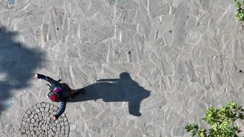 Full aerial view of the man and his shadow playing the zeybek, the most Stock-Footage 246038860