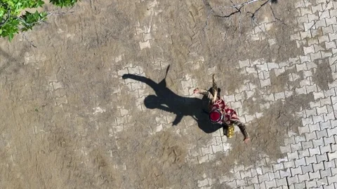 Full aerial view of the man and his shadow playing the zeybek, the most Stock Footage 246038955