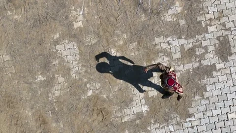 Full aerial view of the man and his shadow playing the zeybek, the most 库存影片 246039040