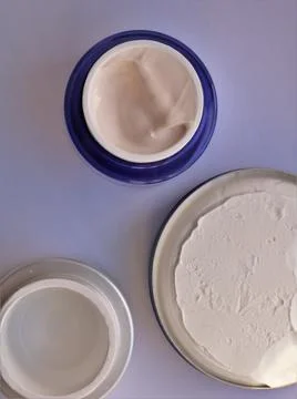 Full and empty flat lay cream jars Stock Photos