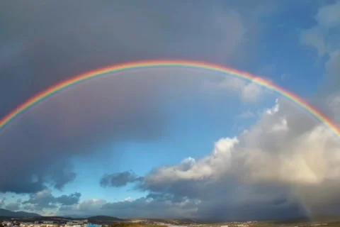 Full Arch Rainbow Over Cloudy Sky - Dramatic Rainbow After Rain Storm Video stock 343792280