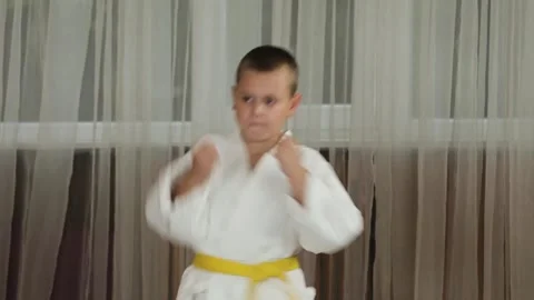 Full athlete performs strikes and blocks with hands with an exit to the rack Stock Footage 247554295